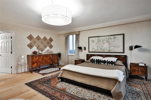 bedroom featuring hardwood / wood-style flooring and crown molding