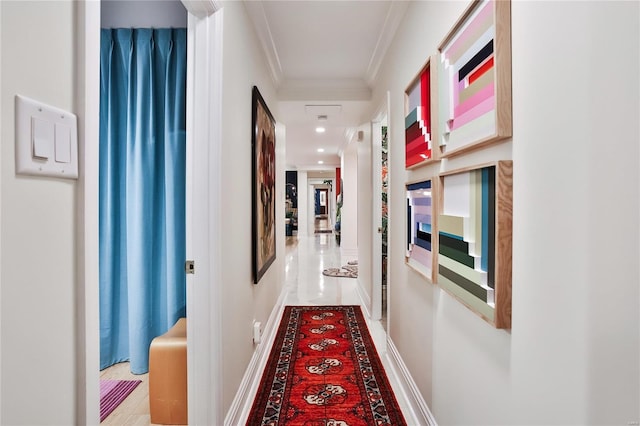 corridor featuring tile patterned floors and ornamental molding