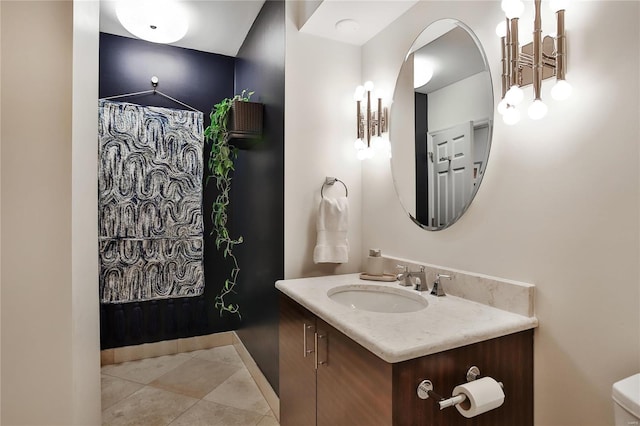 bathroom with tile patterned flooring and vanity