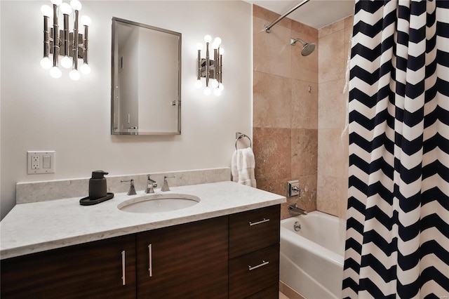 bathroom featuring vanity and shower / bathtub combination with curtain