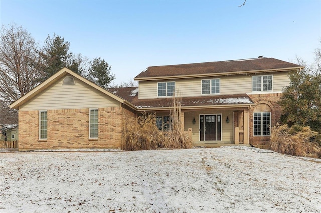 traditional-style home with brick siding