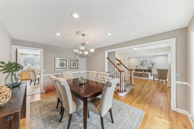 dining space with recessed lighting, stairway, a chandelier, light wood-type flooring, and baseboards