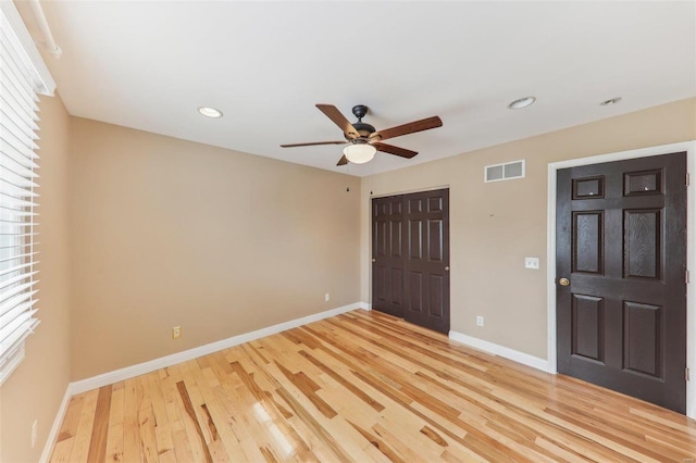 unfurnished bedroom with recessed lighting, a closet, visible vents, light wood-type flooring, and baseboards