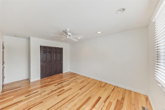 interior space with recessed lighting, visible vents, light wood-style flooring, and baseboards