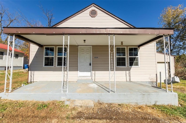 view of front of house with a garage and a porch