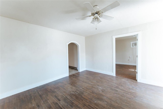 spare room featuring dark hardwood / wood-style floors and ceiling fan