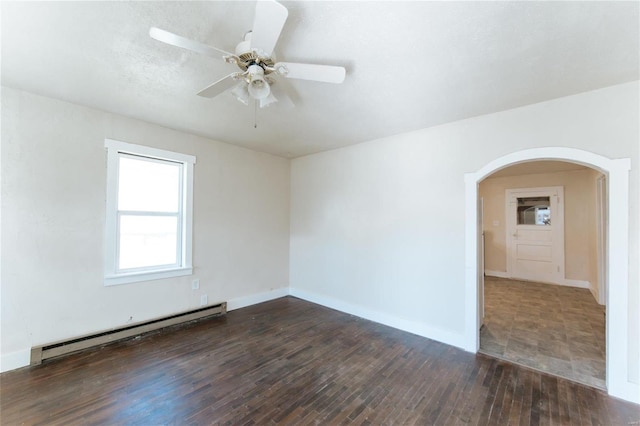 unfurnished room featuring ceiling fan, a baseboard radiator, and dark hardwood / wood-style floors