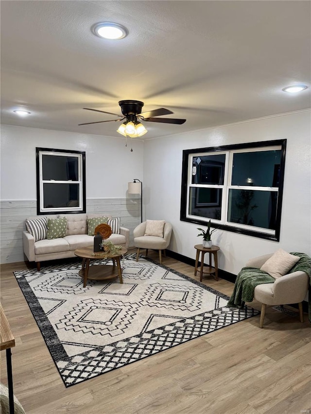 living room with hardwood / wood-style floors and ceiling fan