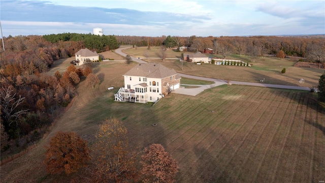 birds eye view of property with a rural view