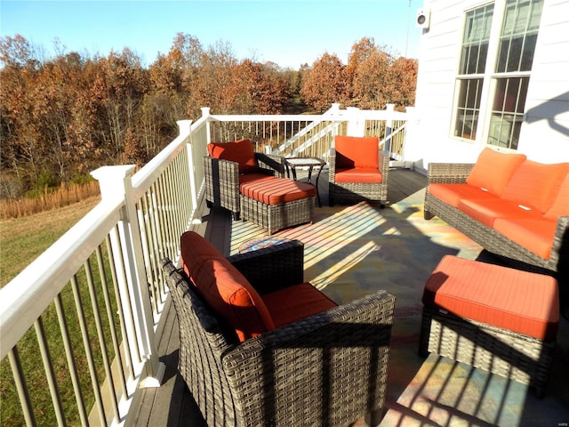 wooden terrace featuring an outdoor hangout area