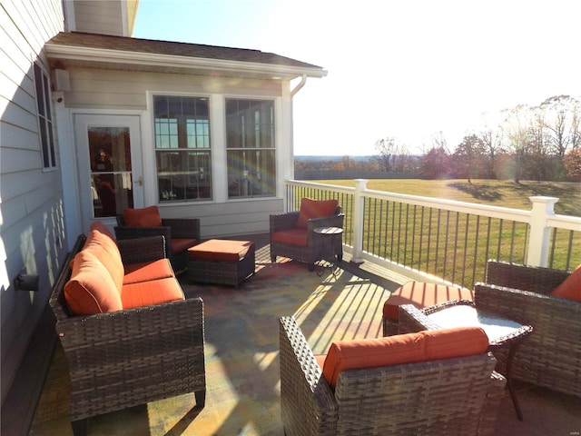 exterior space featuring an outdoor hangout area and a rural view