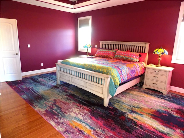 bedroom featuring dark hardwood / wood-style flooring