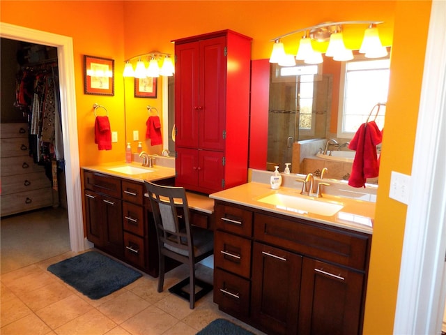 bathroom featuring independent shower and bath, vanity, and tile patterned floors