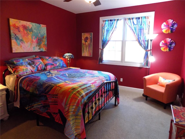 bedroom with ceiling fan and light carpet