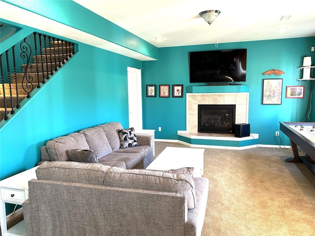 carpeted living room with a fireplace