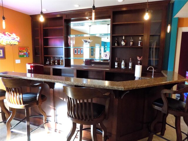 bar featuring decorative light fixtures