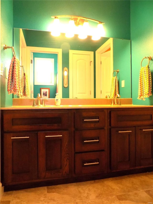 bathroom with vanity and tile patterned flooring