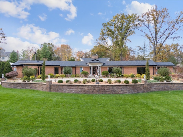 single story home with solar panels and a front lawn