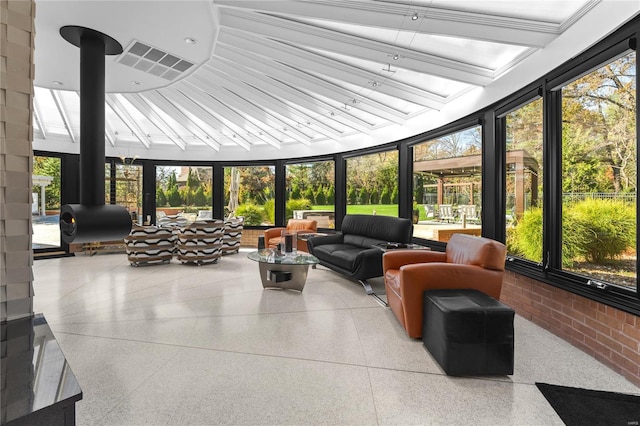 sunroom / solarium featuring vaulted ceiling