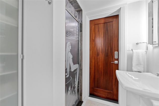 bathroom with sink and walk in shower