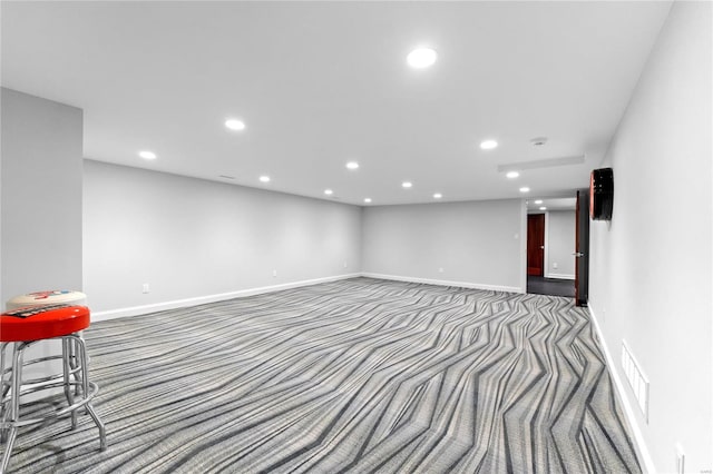 basement with dark carpet