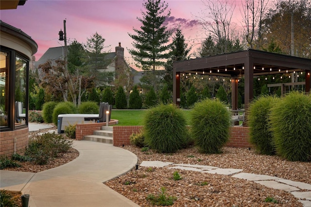 view of property's community with a gazebo and a lawn