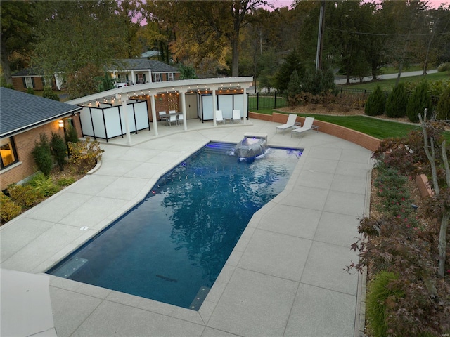 view of swimming pool with pool water feature, an outbuilding, a patio, and an outdoor bar