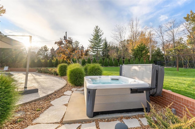 view of patio / terrace with a hot tub