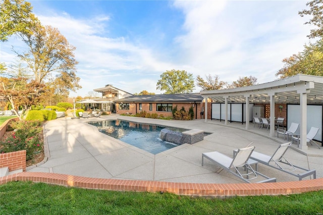 view of swimming pool featuring a patio and a hot tub