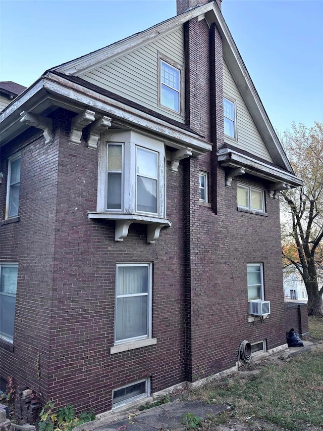 view of side of home with cooling unit