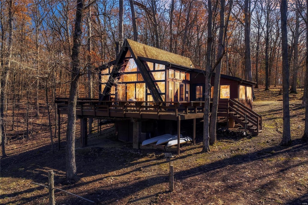 back of house with a wooden deck