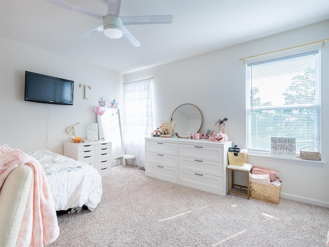 carpeted bedroom with ceiling fan