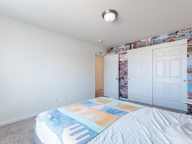 bedroom with light colored carpet and a closet