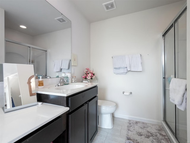 bathroom featuring walk in shower, vanity, and toilet