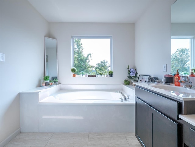 bathroom with vanity, tile patterned floors, and a bathing tub