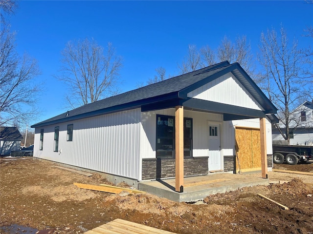 view of property exterior with a porch