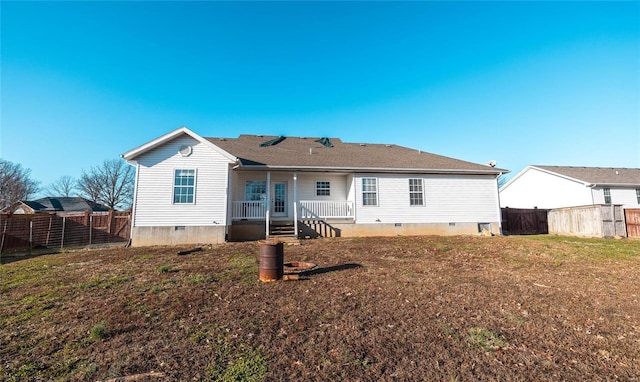 back of house featuring a yard