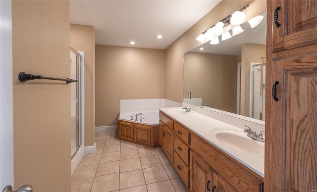 bathroom with shower with separate bathtub, vanity, and tile patterned floors