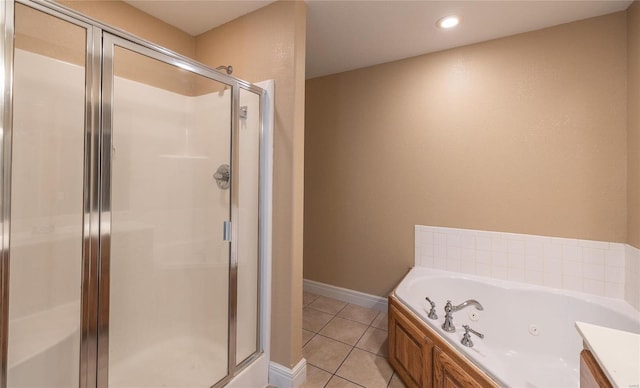 bathroom with separate shower and tub and tile patterned flooring