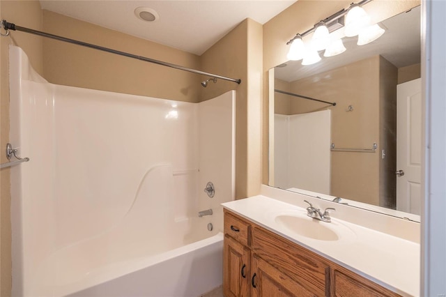 bathroom with shower / bathing tub combination and vanity