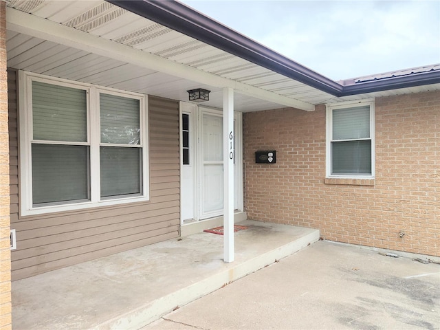 property entrance featuring a patio area