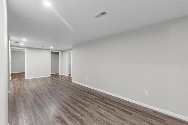 empty room with hardwood / wood-style floors