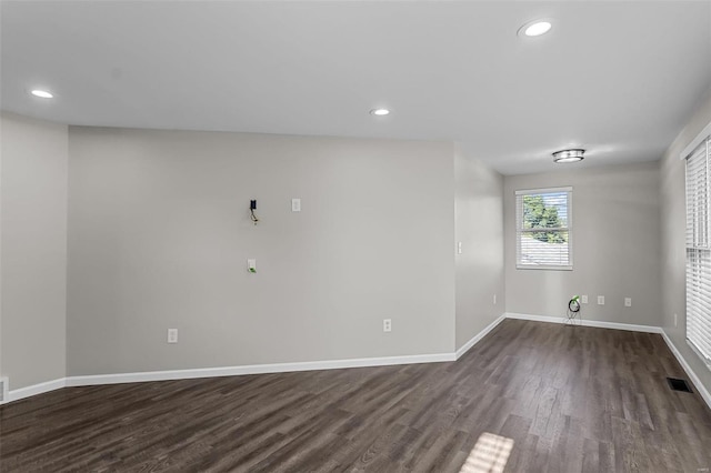 unfurnished room featuring dark hardwood / wood-style floors