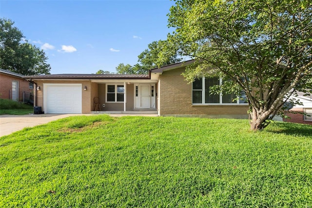 single story home with a front yard and a garage