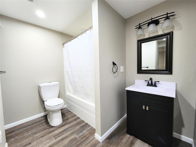 full bathroom featuring wood-type flooring, toilet, vanity, and shower / bath combo