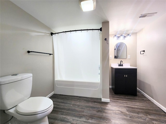 bathroom with hardwood / wood-style floors, toilet, and vanity