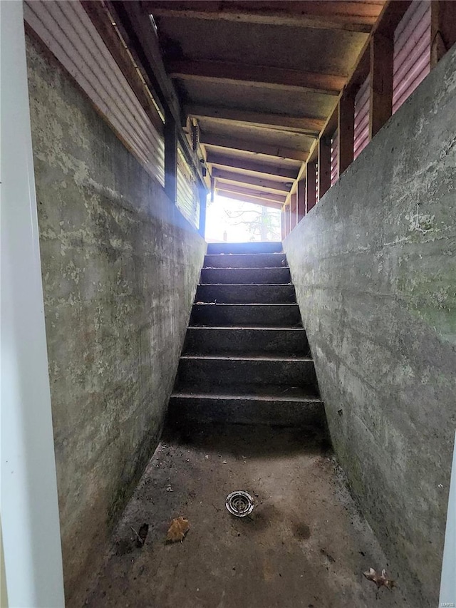 stairs featuring lofted ceiling