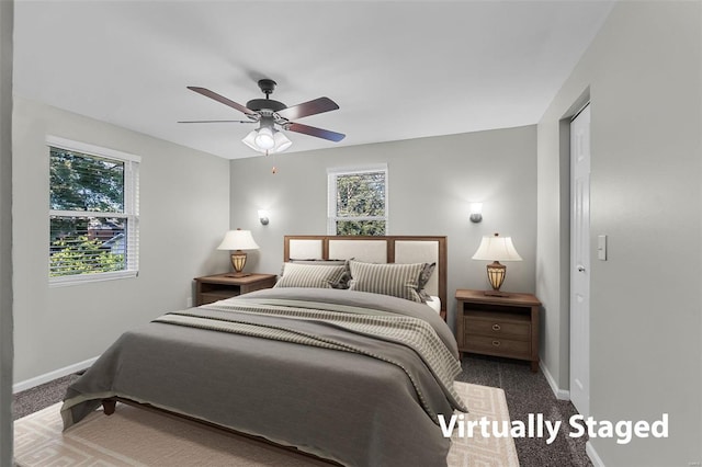 bedroom with ceiling fan and carpet floors