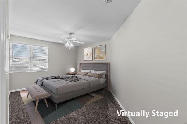 bedroom featuring ceiling fan and carpet