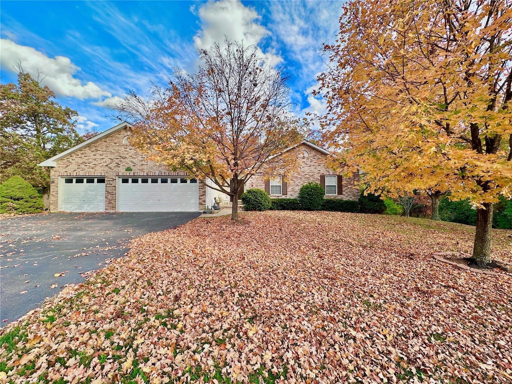 view of front of property with a garage